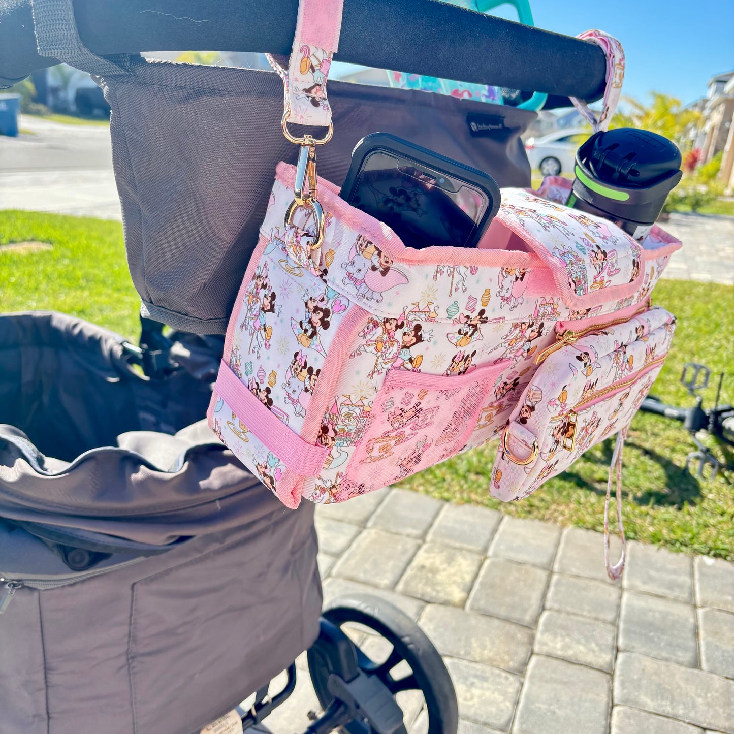 Pink Magical Main Street Stroller Caddy Organizer with Insulated Cup Holders | Detachable Wristlet | Universal Stroller & Wagon Organizer